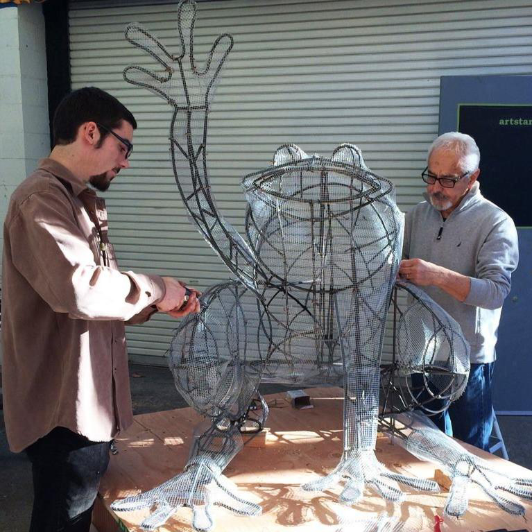 Daniel Doughty and Mario Uribe work on a sculpture