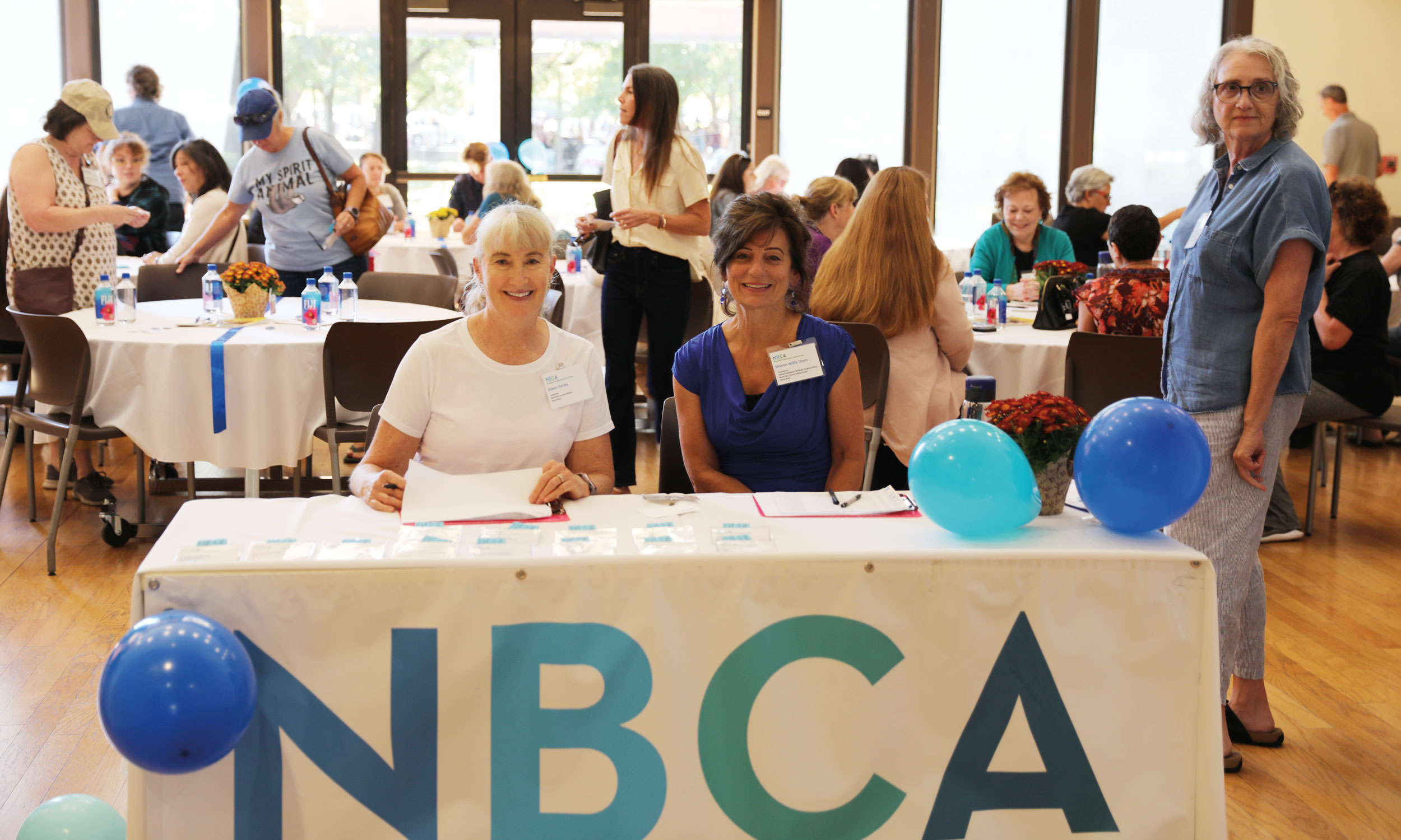 Welcome table at Oncology Professionals Gratitude Day with Sharon Doughty and Eileen Corley