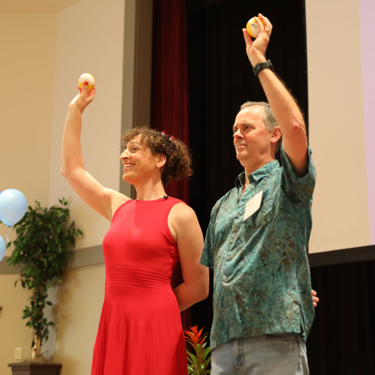 Dr Jackie B demonstrates juggling with Kent Corley